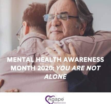 Person hugging another, text reads Mental Health Awareness Month 2020: You Are Not Alone, logo Agape Treatment Center.
