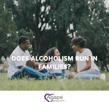 People sitting on grass and talking, text Does Alcoholism Run in Families? logo at bottom.