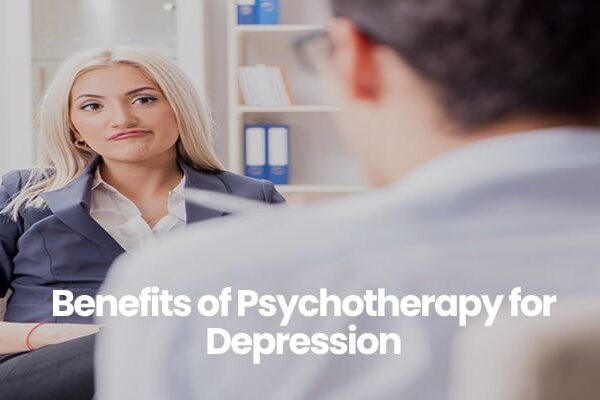 Person in navy blazer listening attentively in a therapy session.