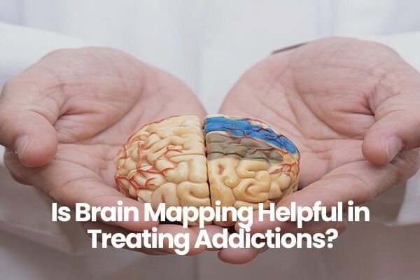 Person in white coat holding a model of a brain with text about brain mapping and addictions.