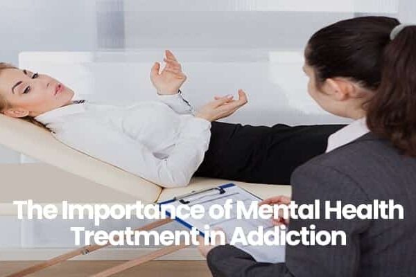 Person in white shirt lying on a therapy couch talking to a professional.