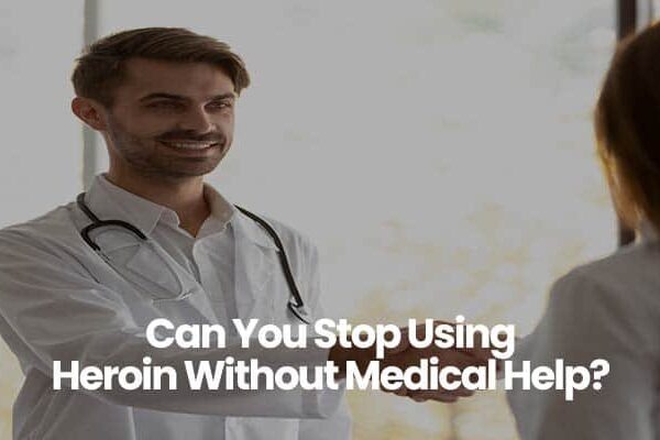 Person wearing a white coat with stethoscope, holding a conversation.