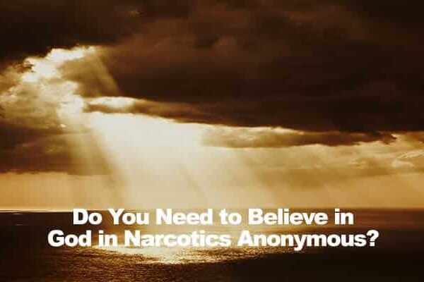 Sunbeams breaking through cloudy sky over ocean with text Do You Need to Believe in God in Narcotics Anonymous?