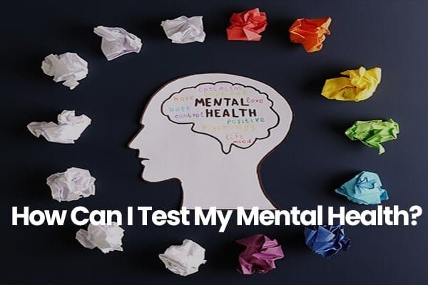 Silhouette with words like mental health surrounded by colorful crumpled paper.
