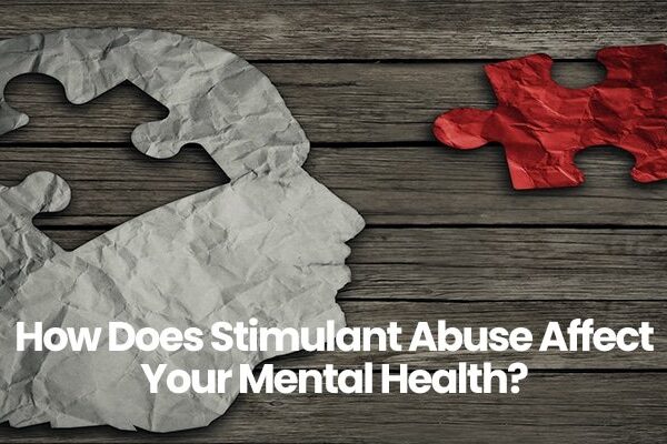 Paper head silhouette with missing puzzle piece, question about stimulant abuse impact on mental health.