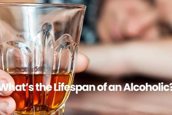 Person holding a glass of amber liquid with text What's the Lifespan of an Alcoholic? in front.