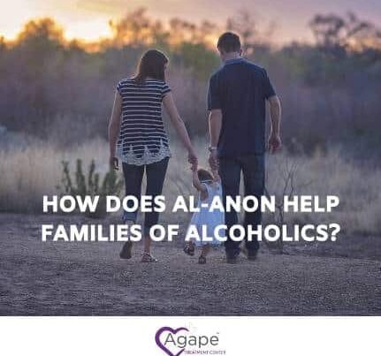 Person holding child's hand while walking in a field, text overlay How does Al-Anon help families of alcoholics?
