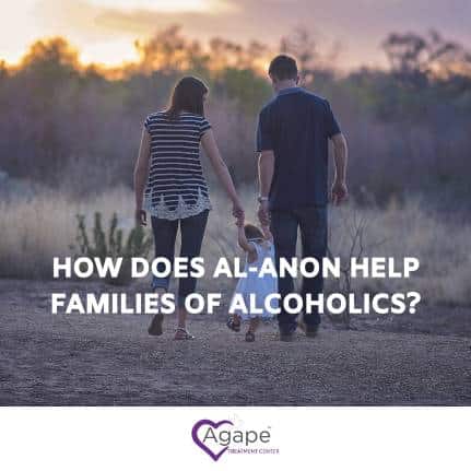 Person holding child's hand while walking in a field, text overlay How does Al-Anon help families of alcoholics?