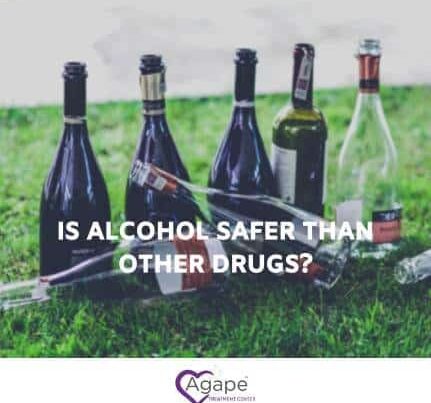 Empty bottles on grass with text Is alcohol safer than other drugs? and Agape Treatment Center logo.
