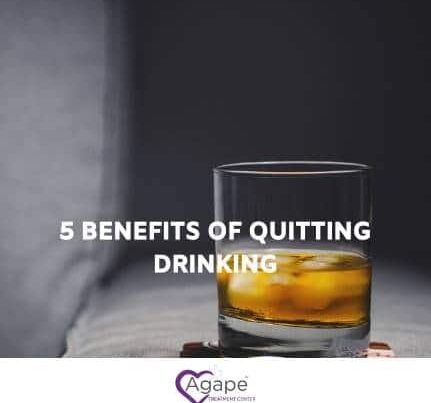 Glass of whiskey on table with text 5 Benefits of Quitting Drinking above Agape Treatment Center logo.