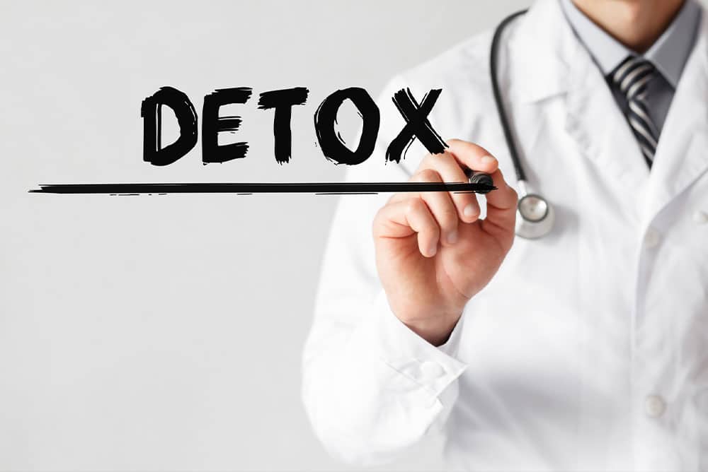 doctor writing detox at a florida medication assisted treatment center