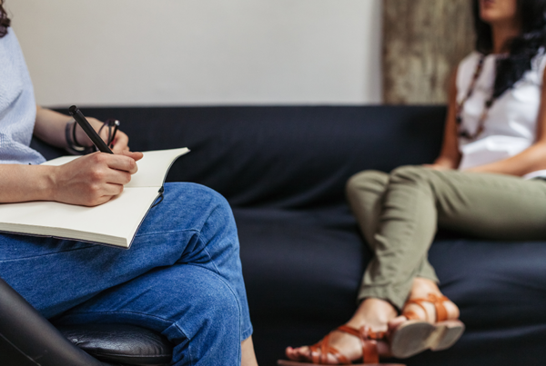 addiction therapy patient sitting on couch