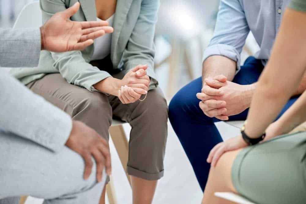 group of four sitting in chairs