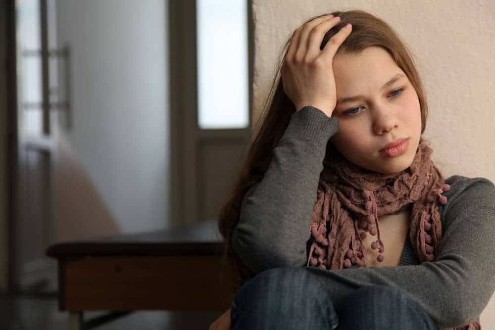 young woman experiencing alcohol addiction