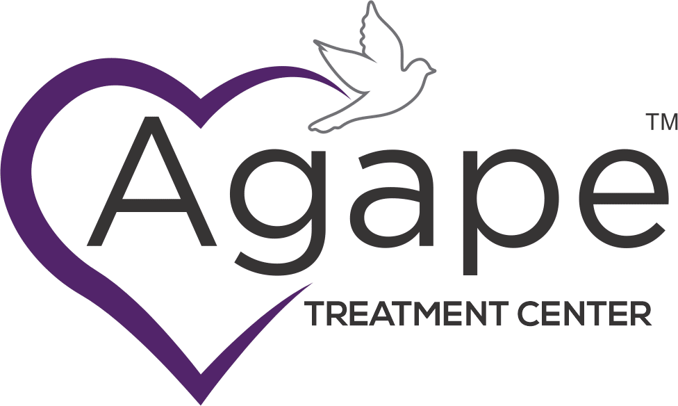 Agape Treatment Center logo with purple heart and dove.